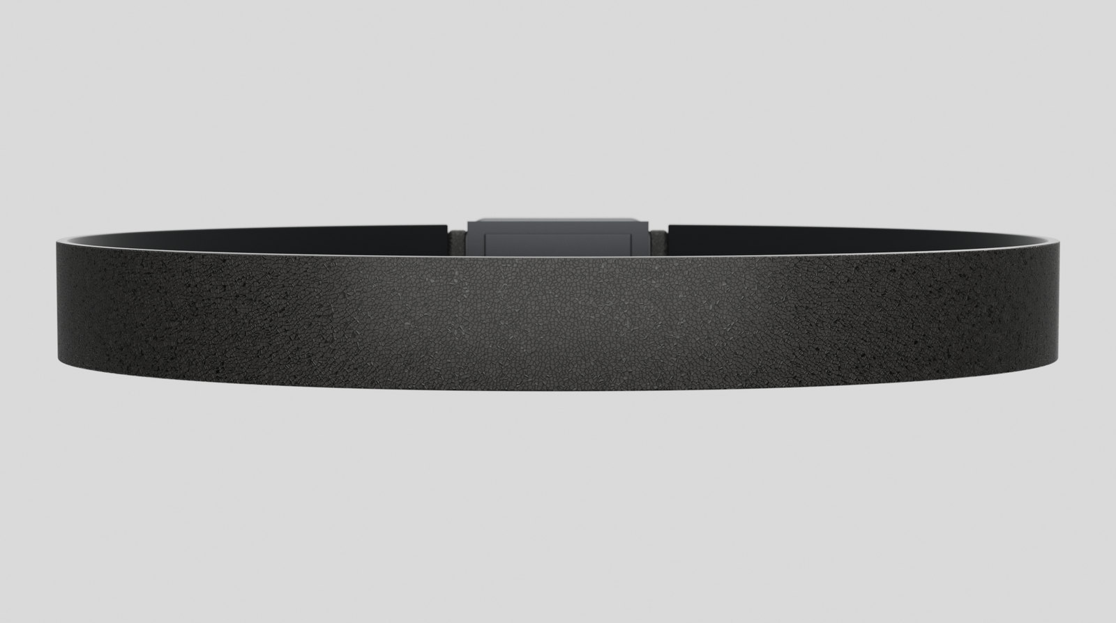Body side of the Vyldor belt, showing the microfibre liner over the haptic zones and the rear electronics spine